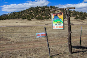 Picture of Open Range Real Estate LLC sign along highway 12 in New Mexico